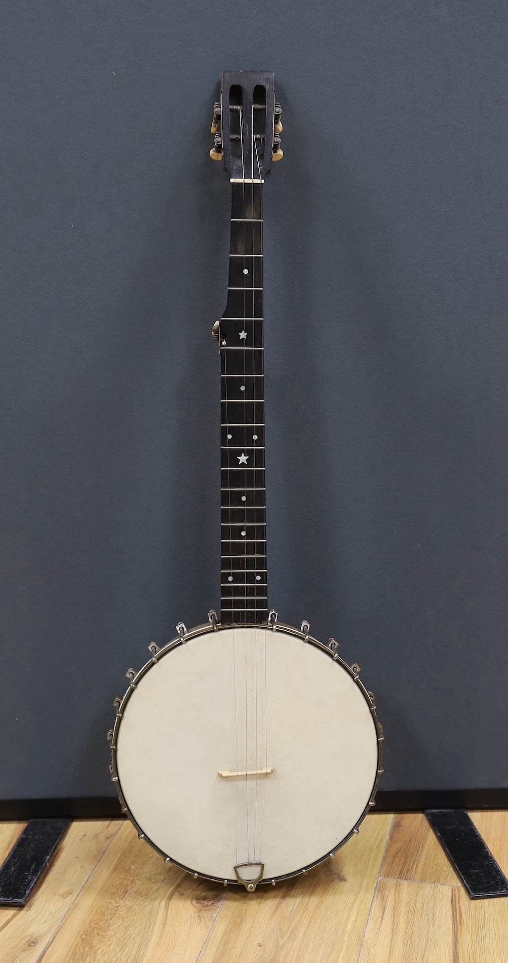 A cased Reliance banjo, 88cms long